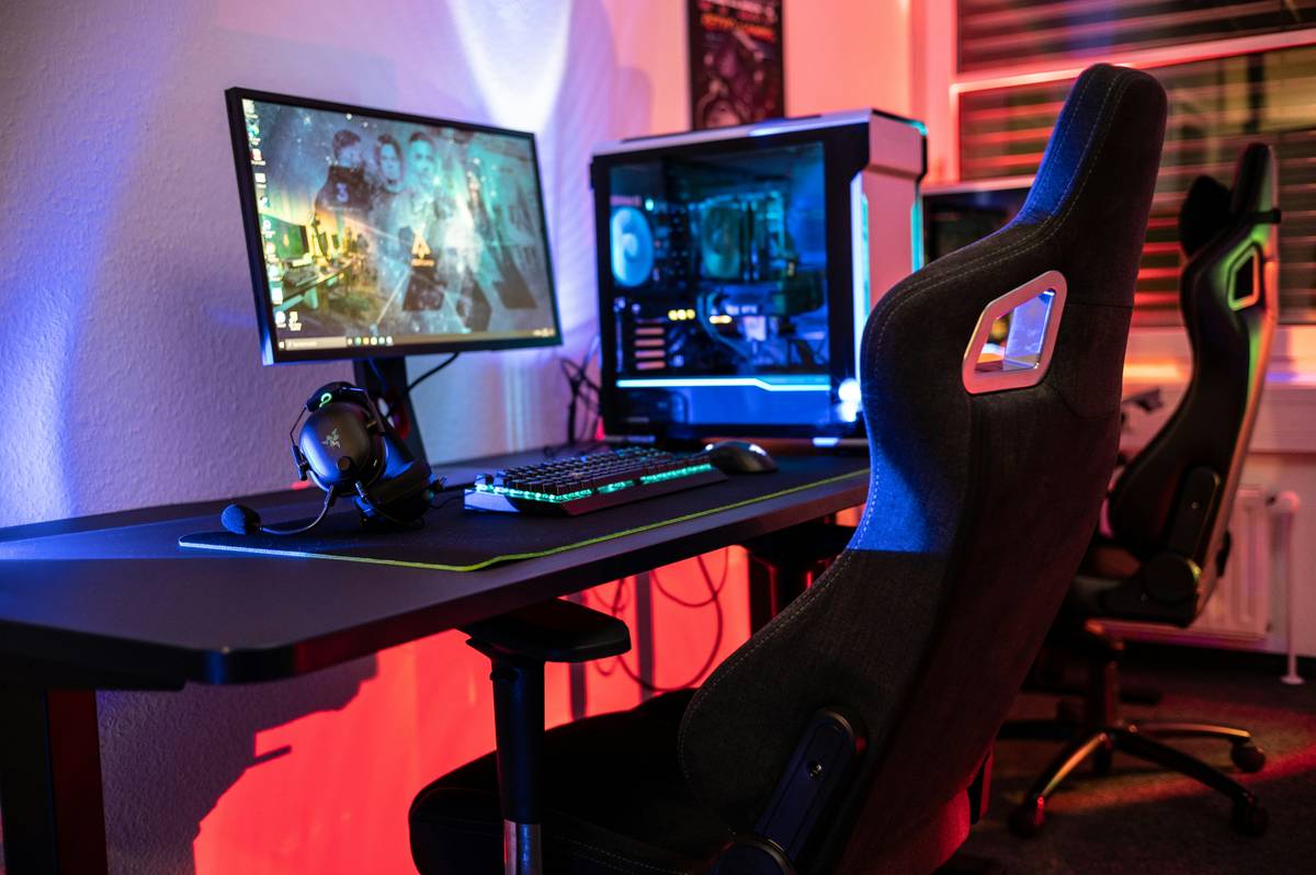 Gamer using a supportive gaming floor chair during late-night session