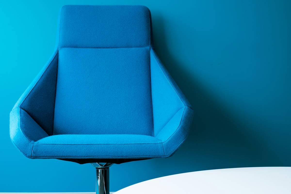 is gaming chair good for work: side-by-side comparison showing slumped posture in bean bag vs upright support in ergonomic chair