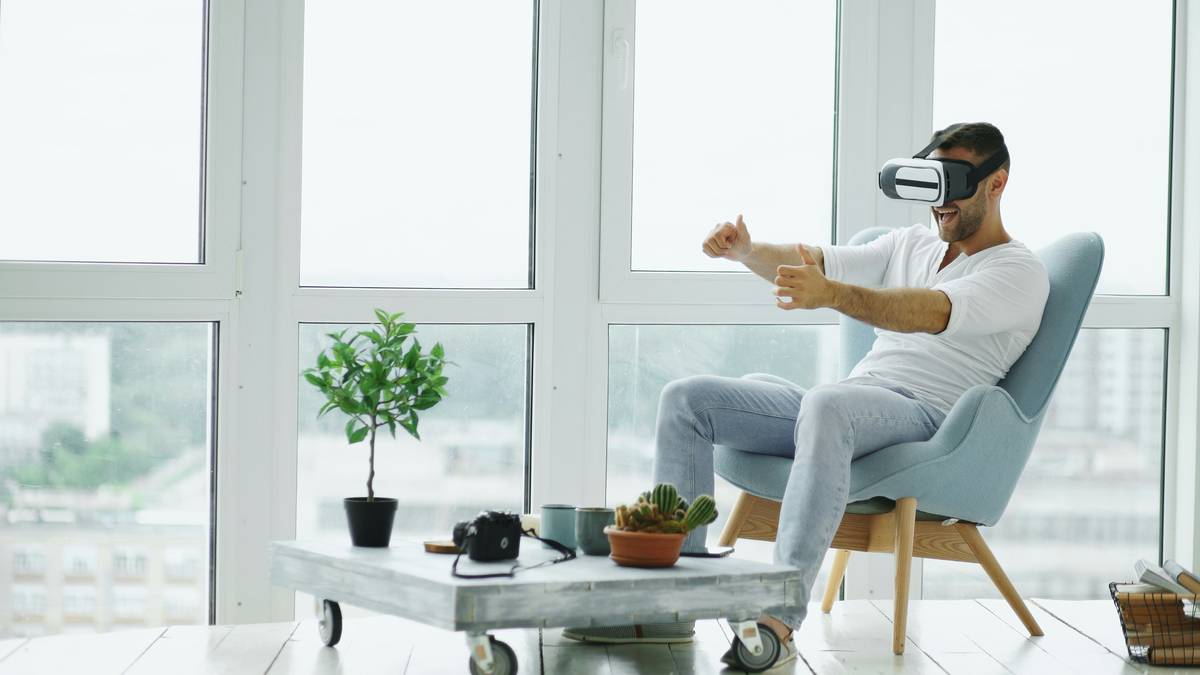 gaming chair for heavy person shown in a well-lit gaming setup with reinforced steel base and wide seat